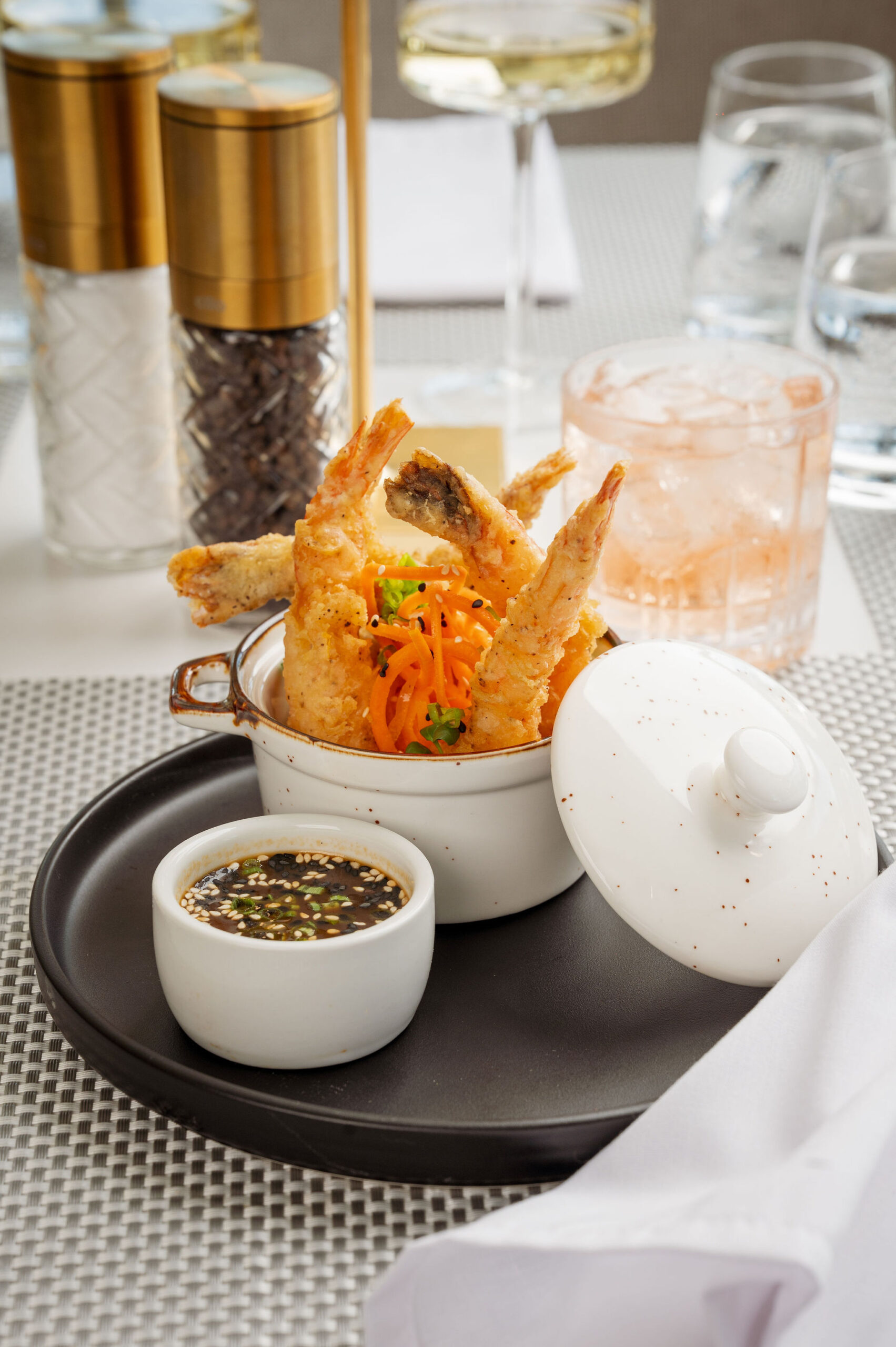 Crispy Tempura Shrimp appetizer served with a flavorful Soy Ginger Reduction dipping sauce and Smoked Sriracha Aioli, garnished with chives, a popular starter at 277 Restaurant in Trinidad.